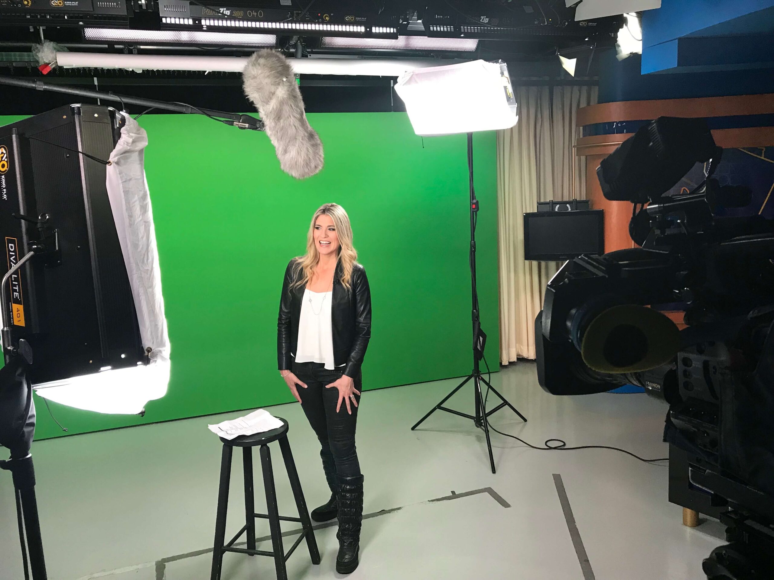 Aphrodite Salas speaking in front of a green screen