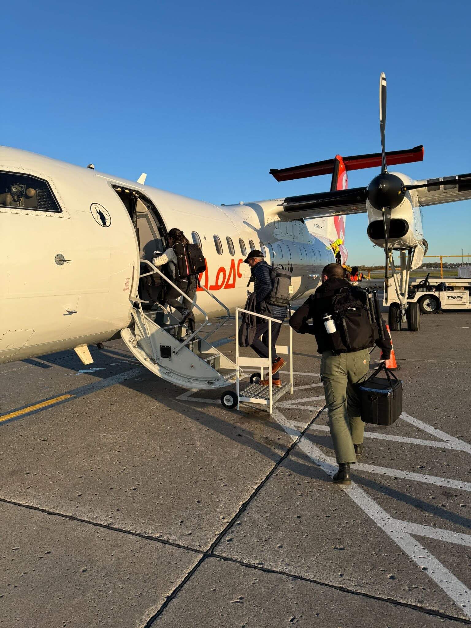 Two people boarding a plane