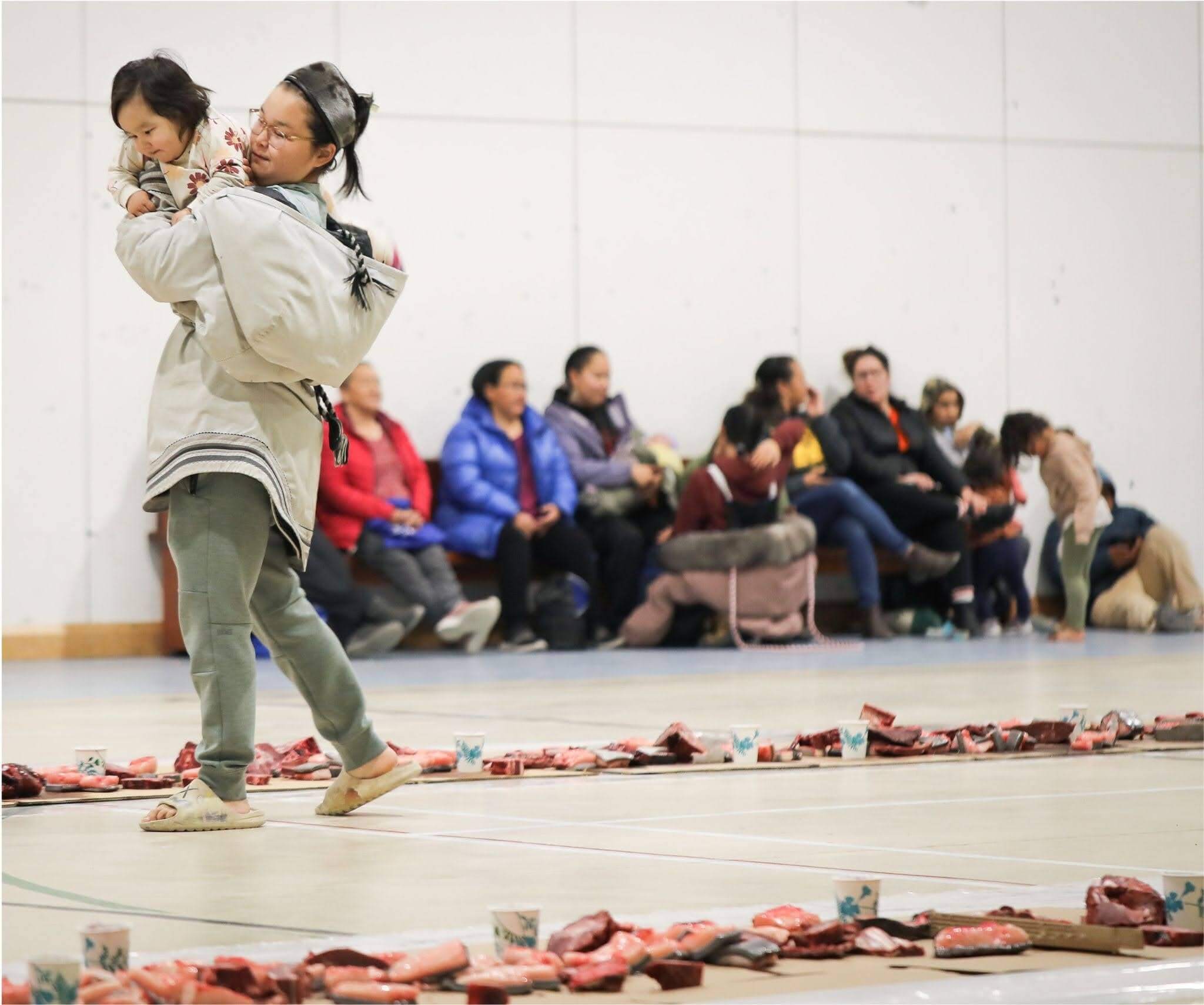 Adult and young child at a community celebration